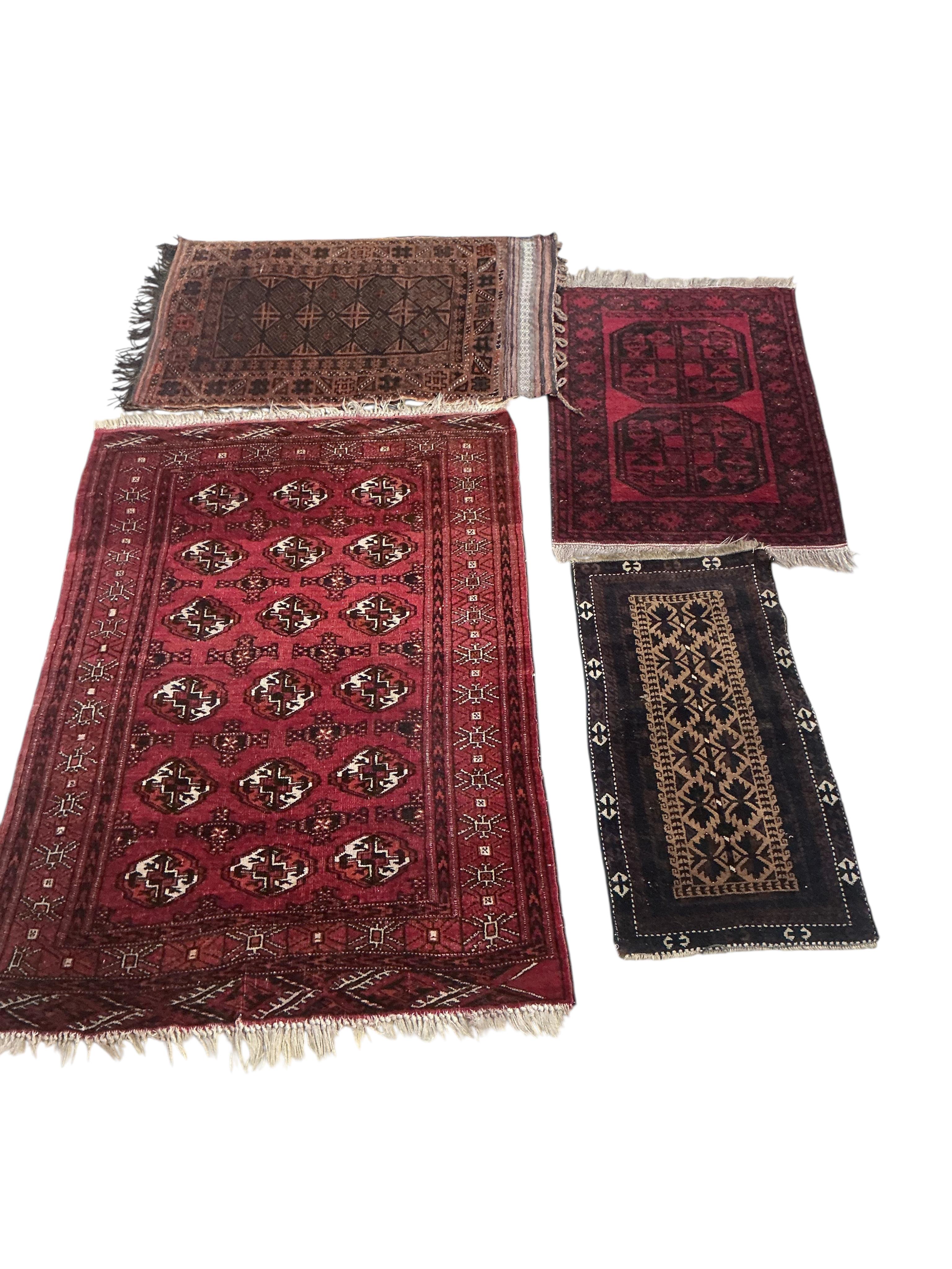 Four assorted Belouch and Afghan rugs, largest 150 x 100cm